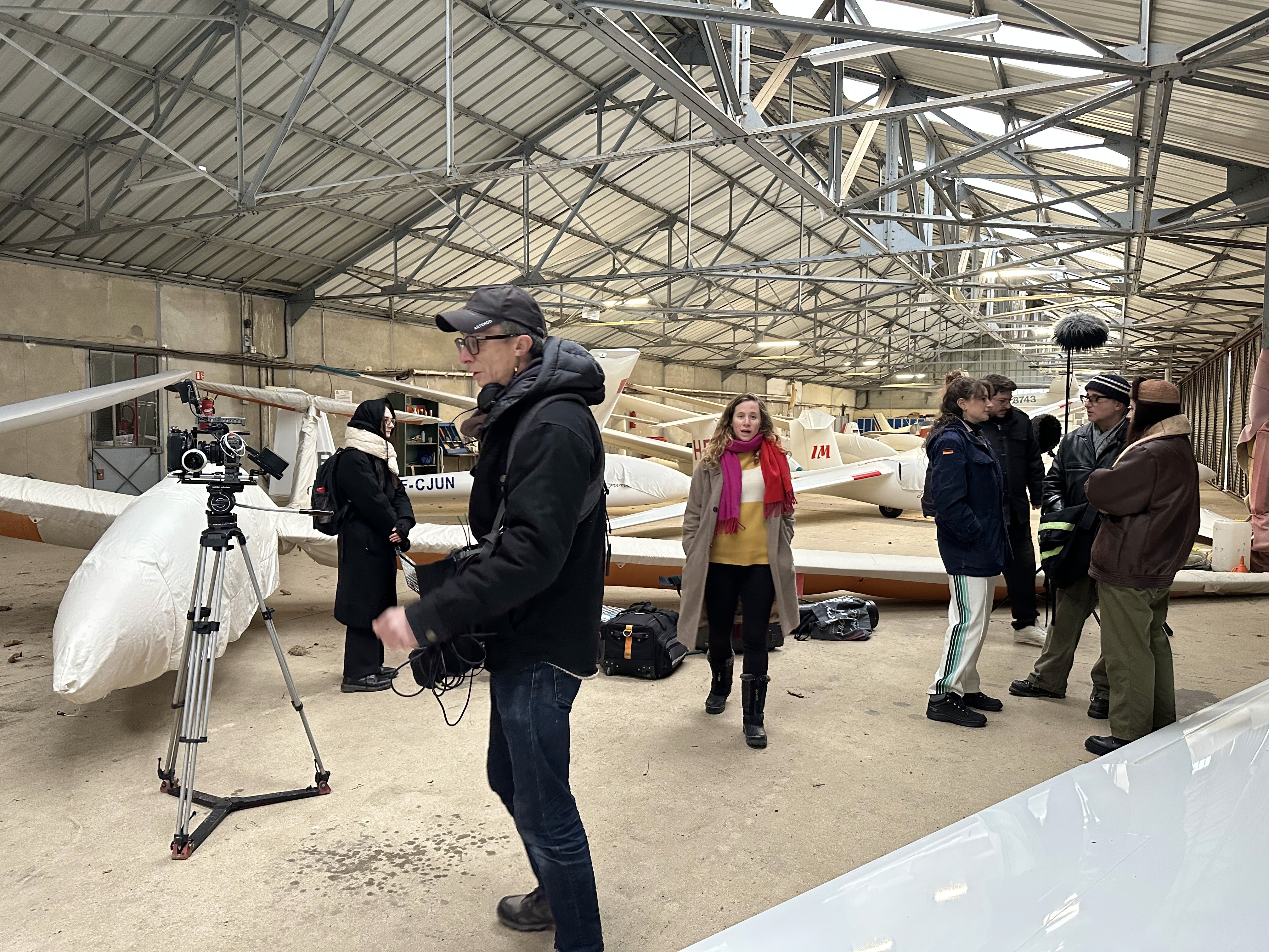 Athletes resting on a track after training.