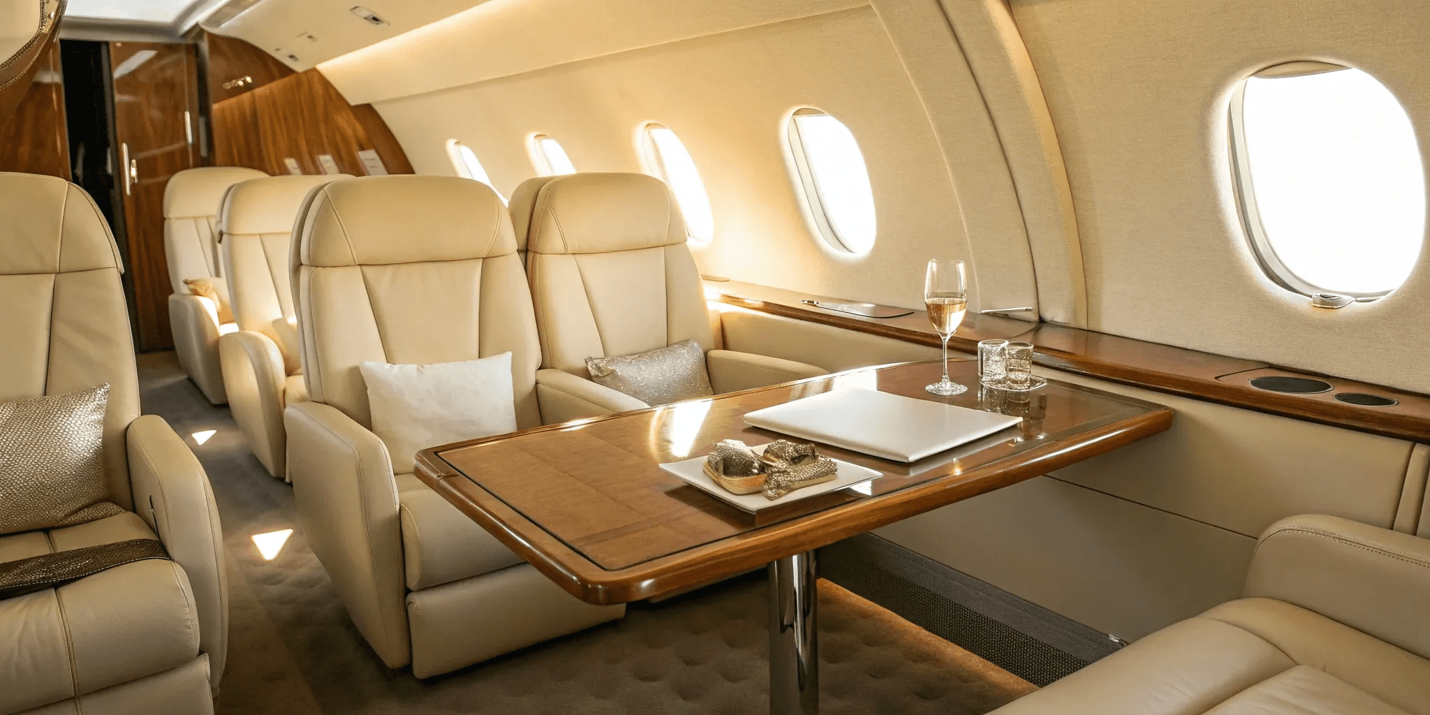 Luxury private jet parked on the runway beside a black executive car, representing premium private aviation and seamless travel service.