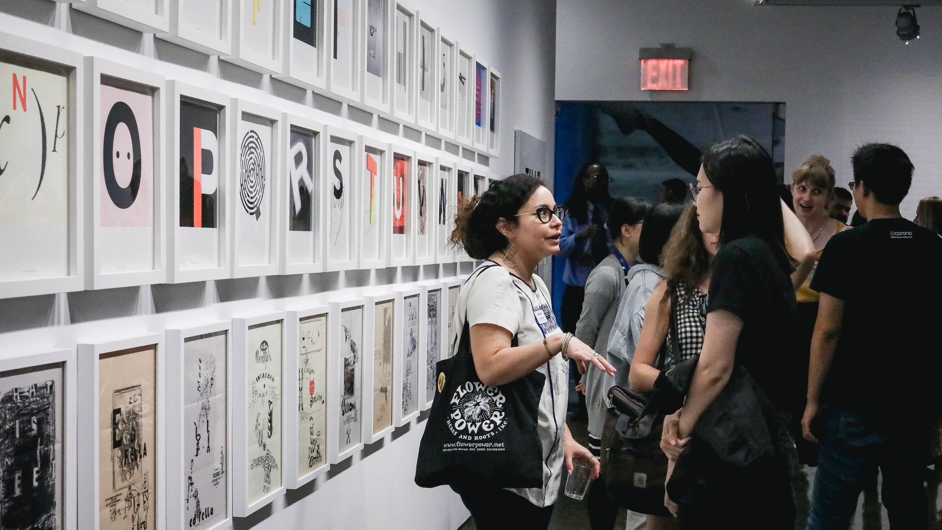 Guests discussing the displayed work at Chelsea