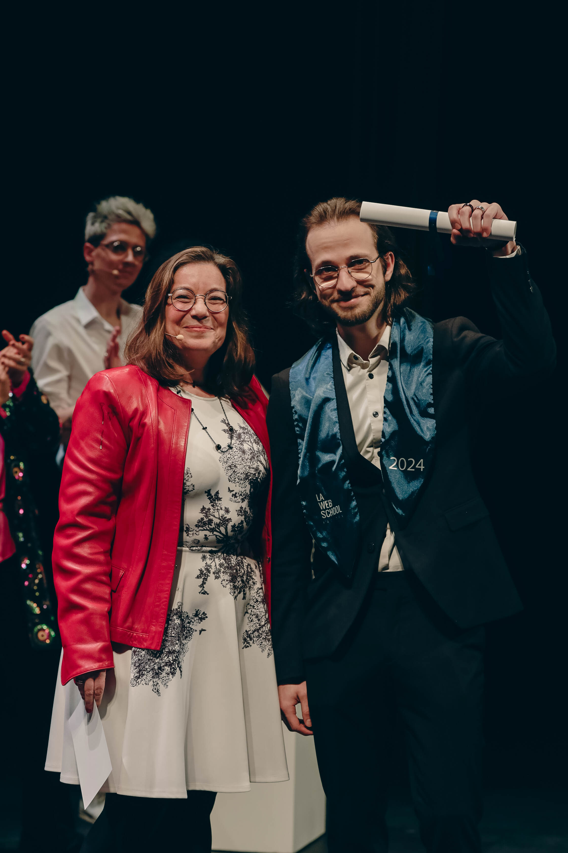 A picture of me (Axel Dufour) brandishing my diploma up high (the Web School Factory's diploma) at the handover ceremony.