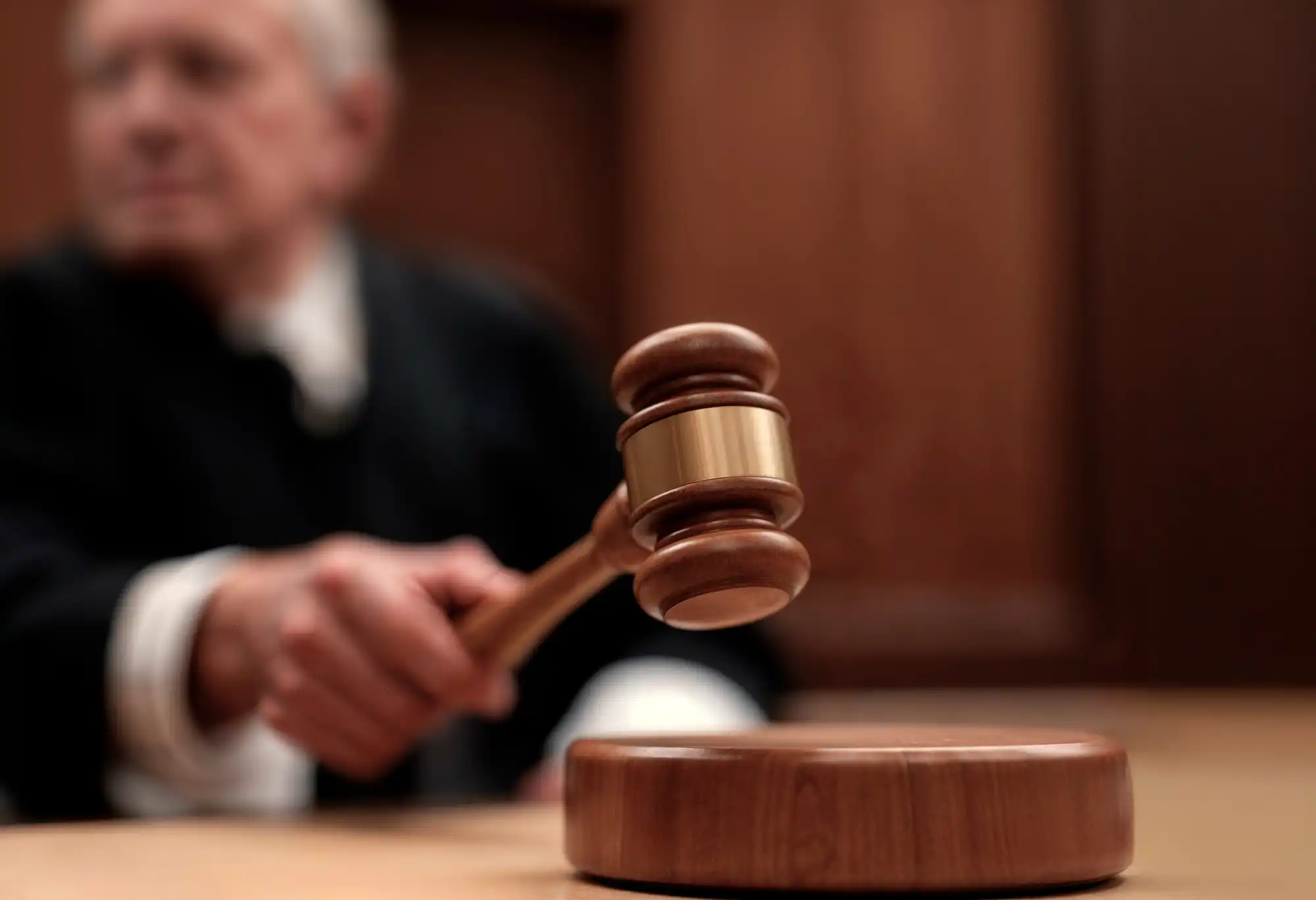 A judge's gavel symbolizes Australia's new social media ban for teens, forcing Big Tech to comply.