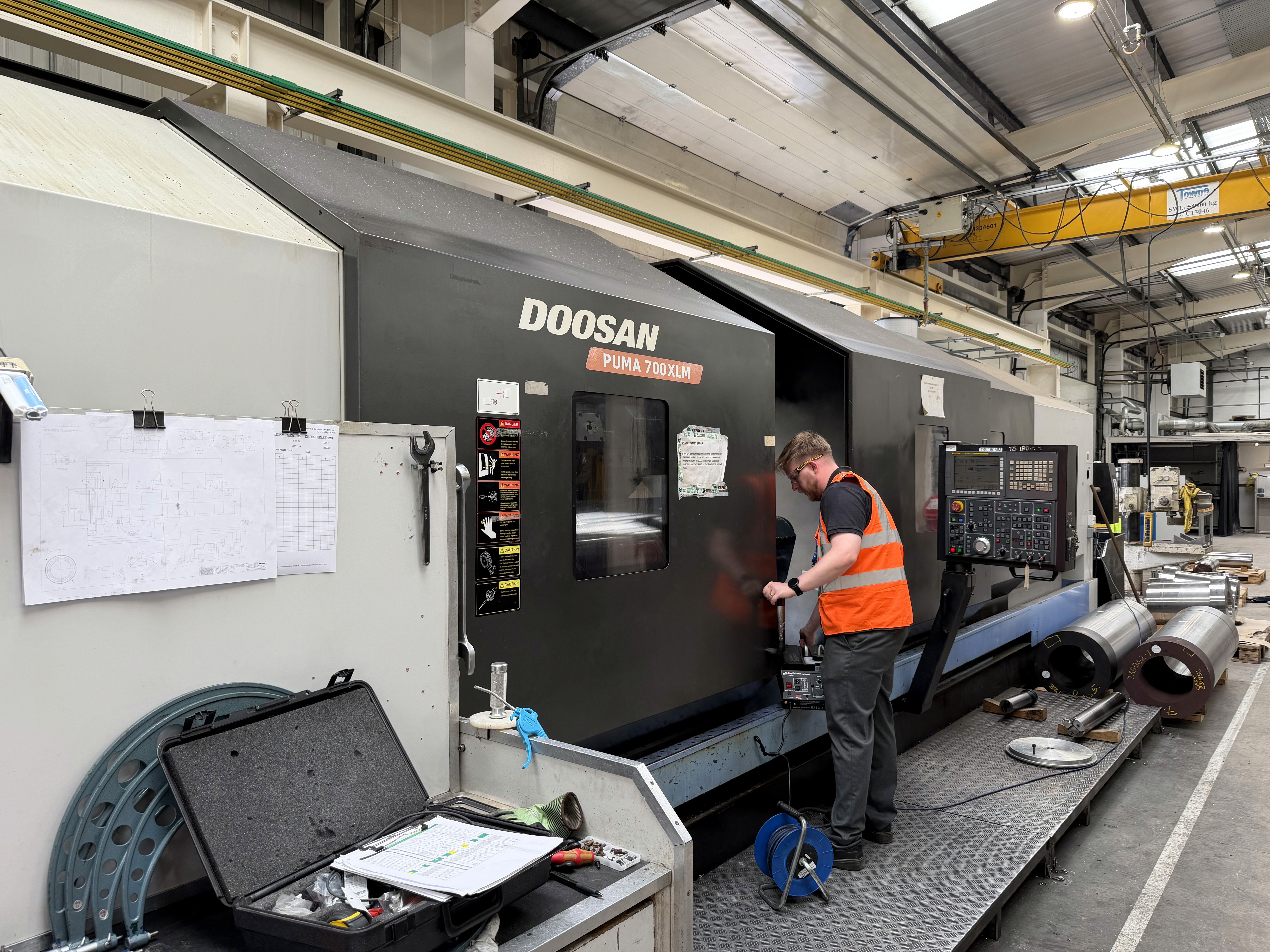 Occupational hygienist testing a CNC LEV system