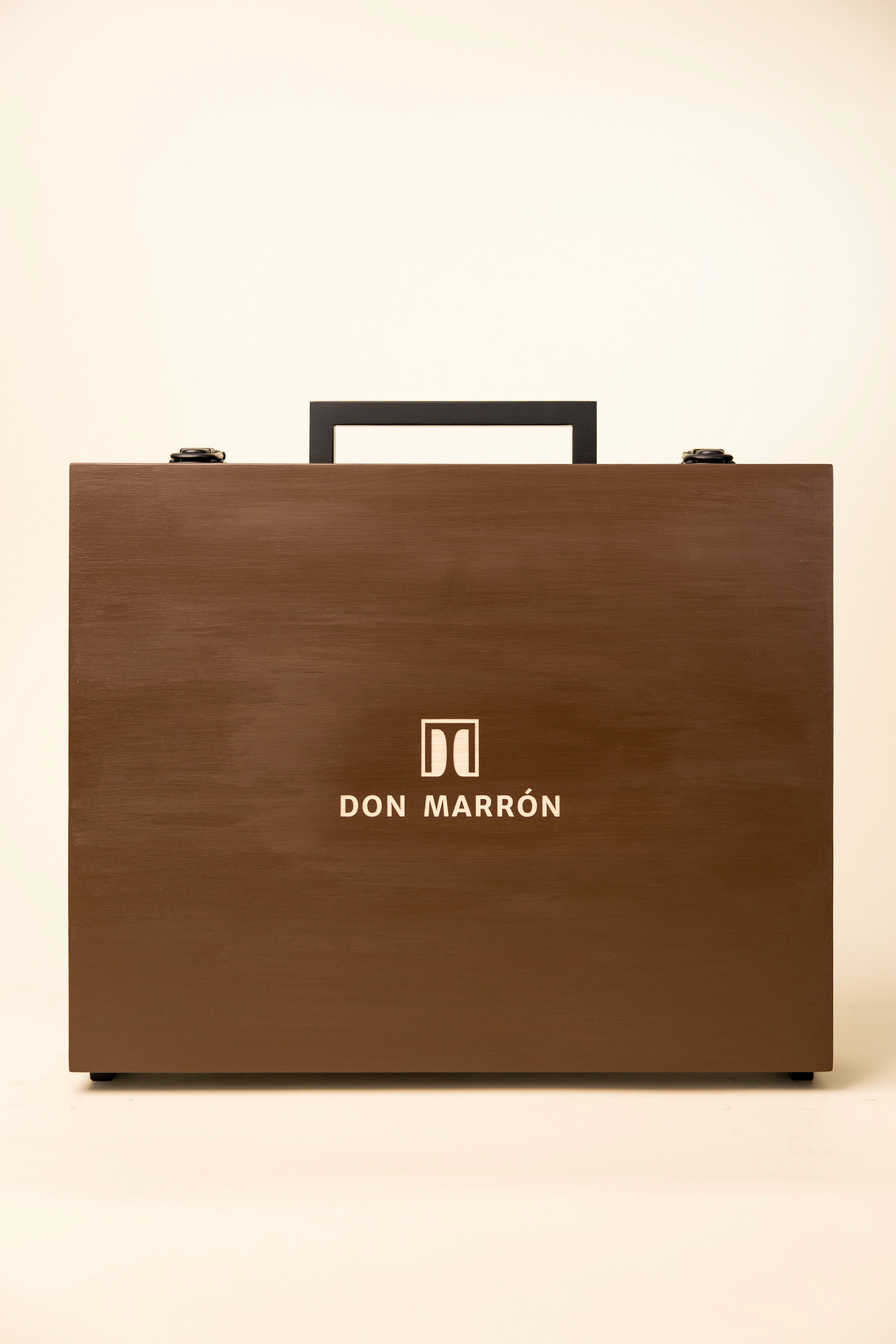 Two Don Marrón members in tailored Italian jackets and loafers overlooking the Amalfi Coast, embodying modern luxury, confidence, and timeless craftsmanship.