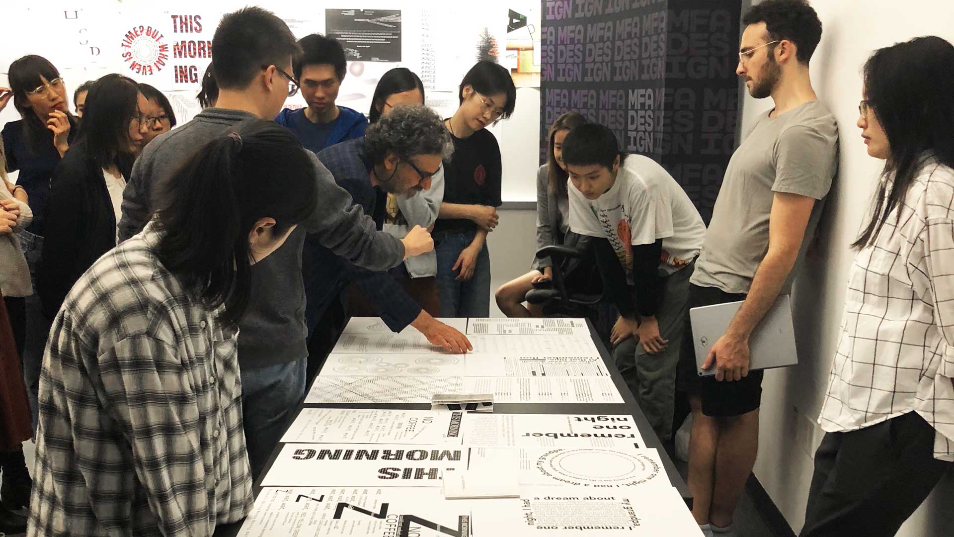 students viewing design work in classroom