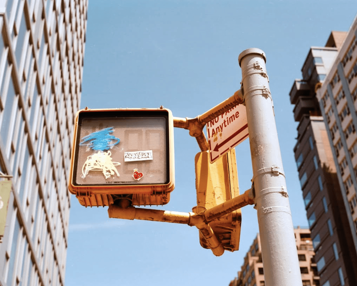 Stack of modern books and magazine with minimalist cover design on leather chair