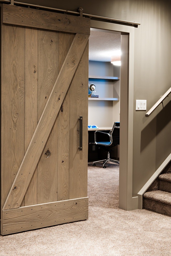 Image of KHD Homes interior design featuring a sliding barn door and home office space with layout design.