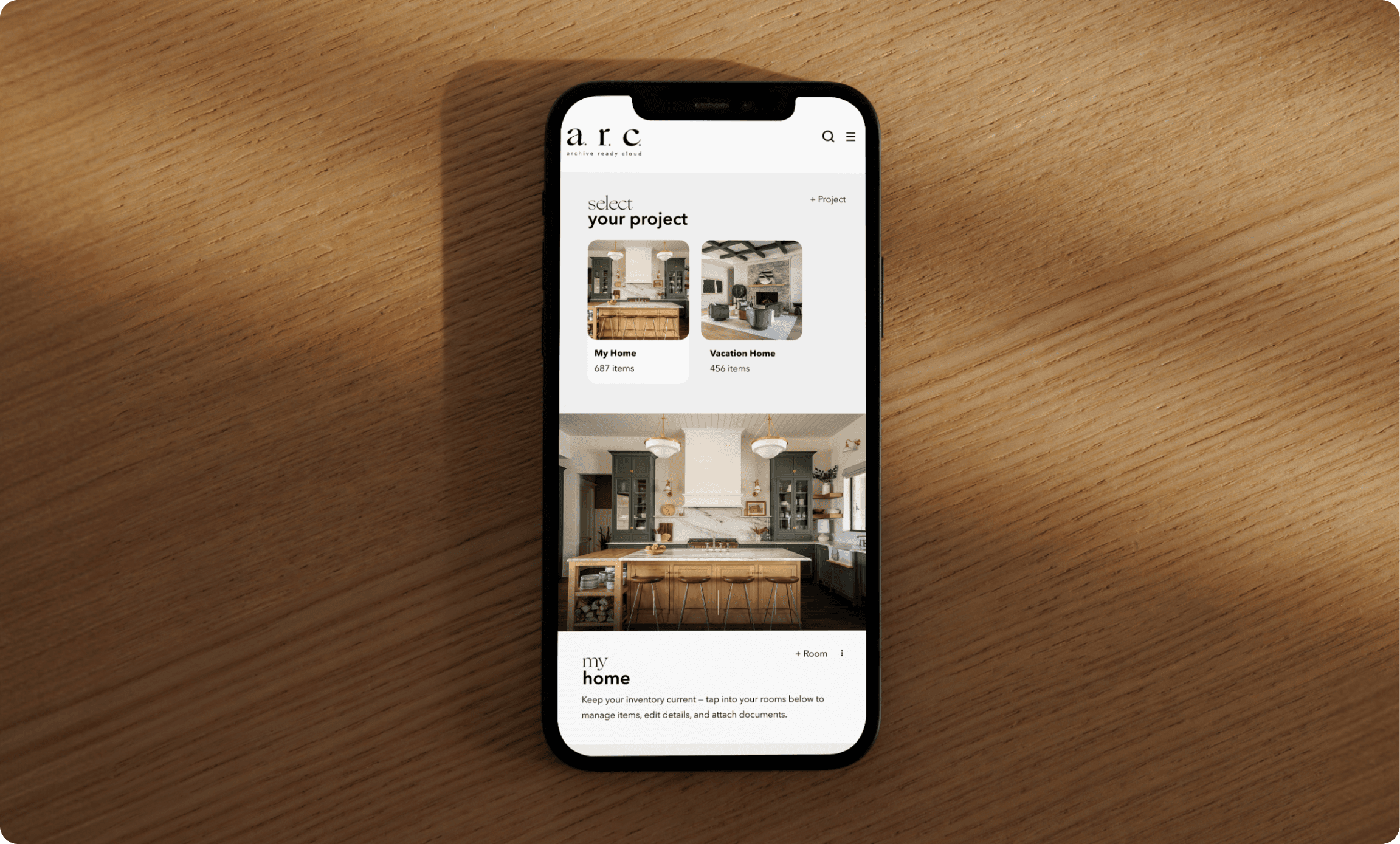 Hill country living room with cognac leather sofa, exposed wood beams, and open concept kitchen with sage green cabinets