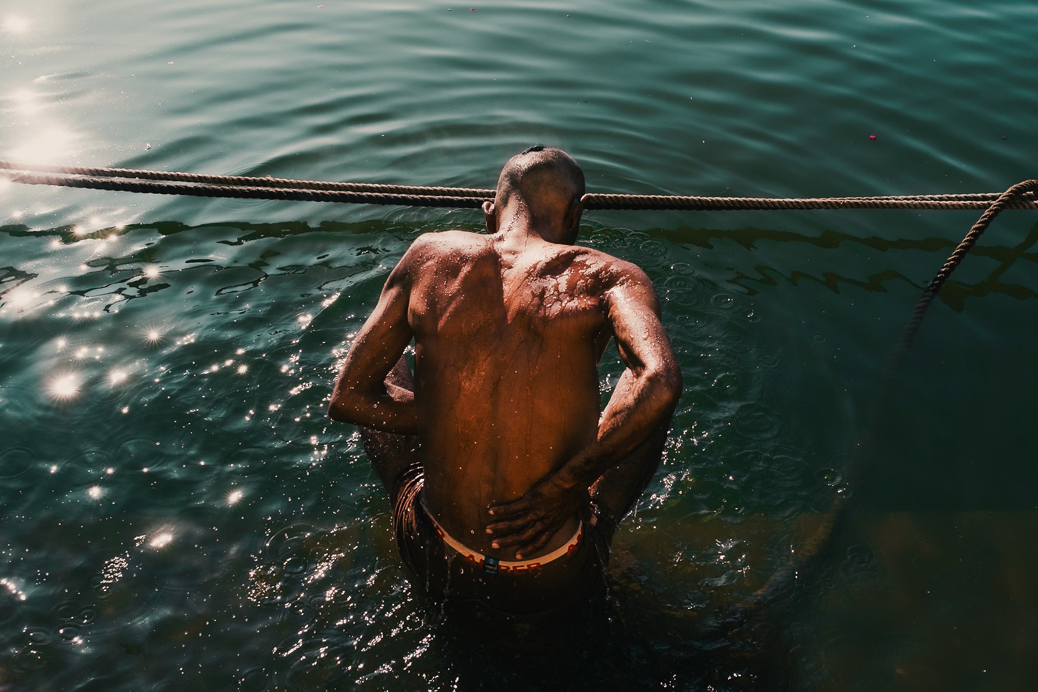 Man taking bath in Pushkar lake.