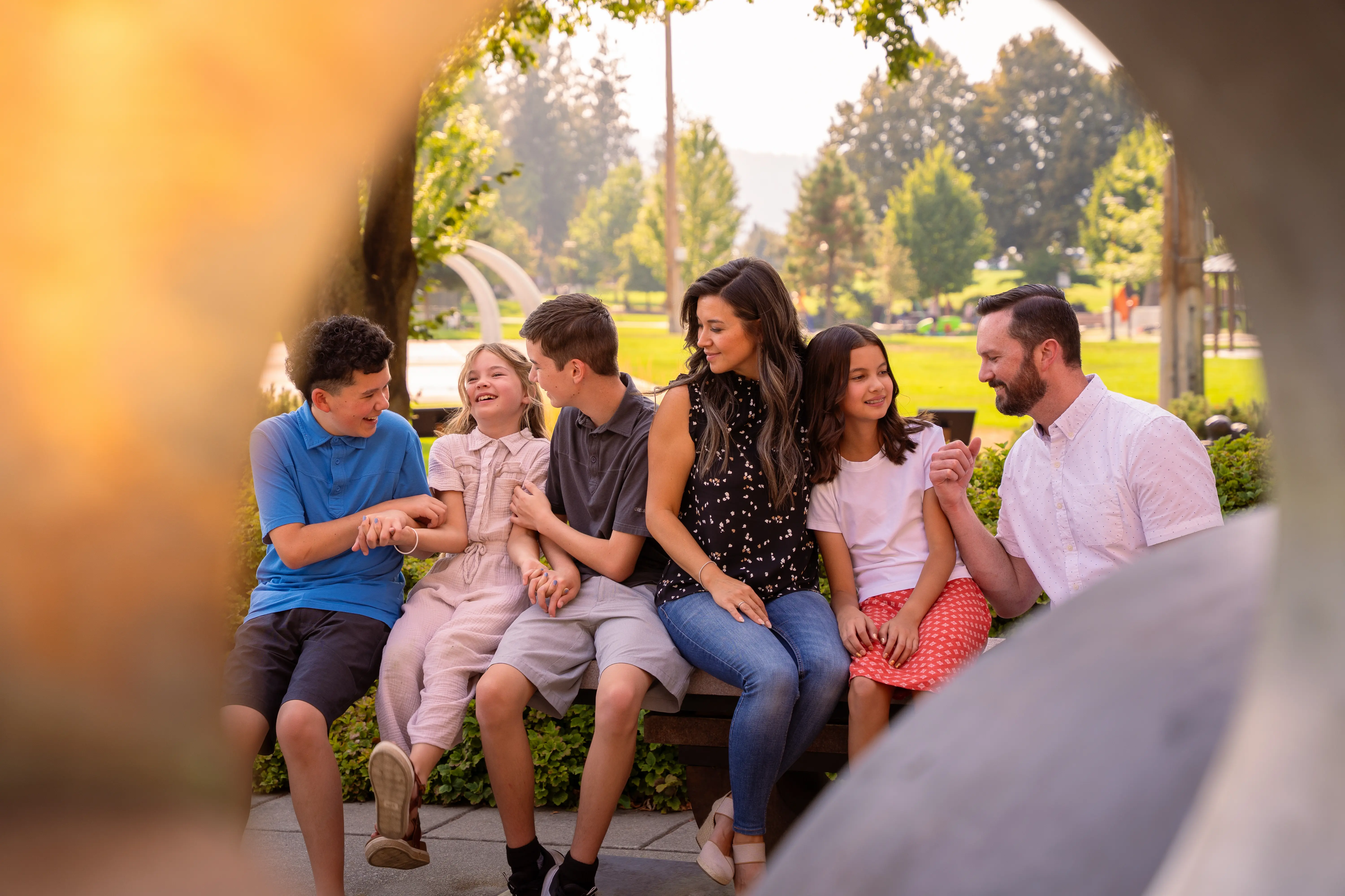  a family photo with an object circling around making a frame
