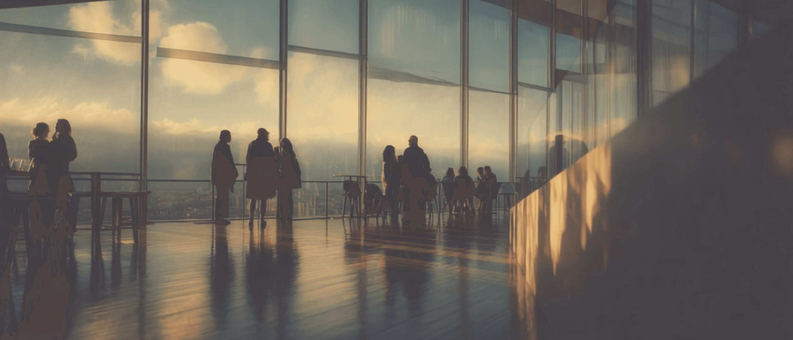 A group of people standing near large glass windows during sunset, capturing the calm before a memorable gathering. 