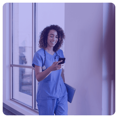 Female healthcare practitioner using SMS text with a colleague for fast patient care transition