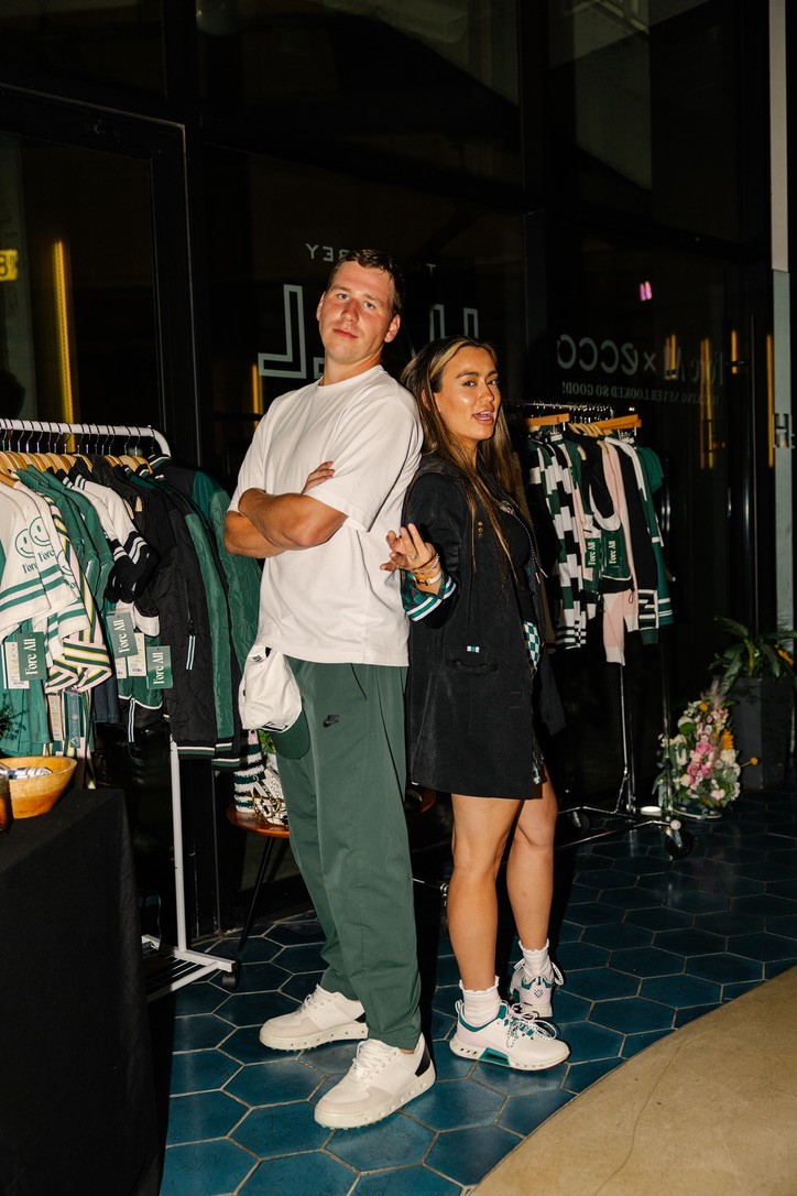 Photographer directing model in a studio setting