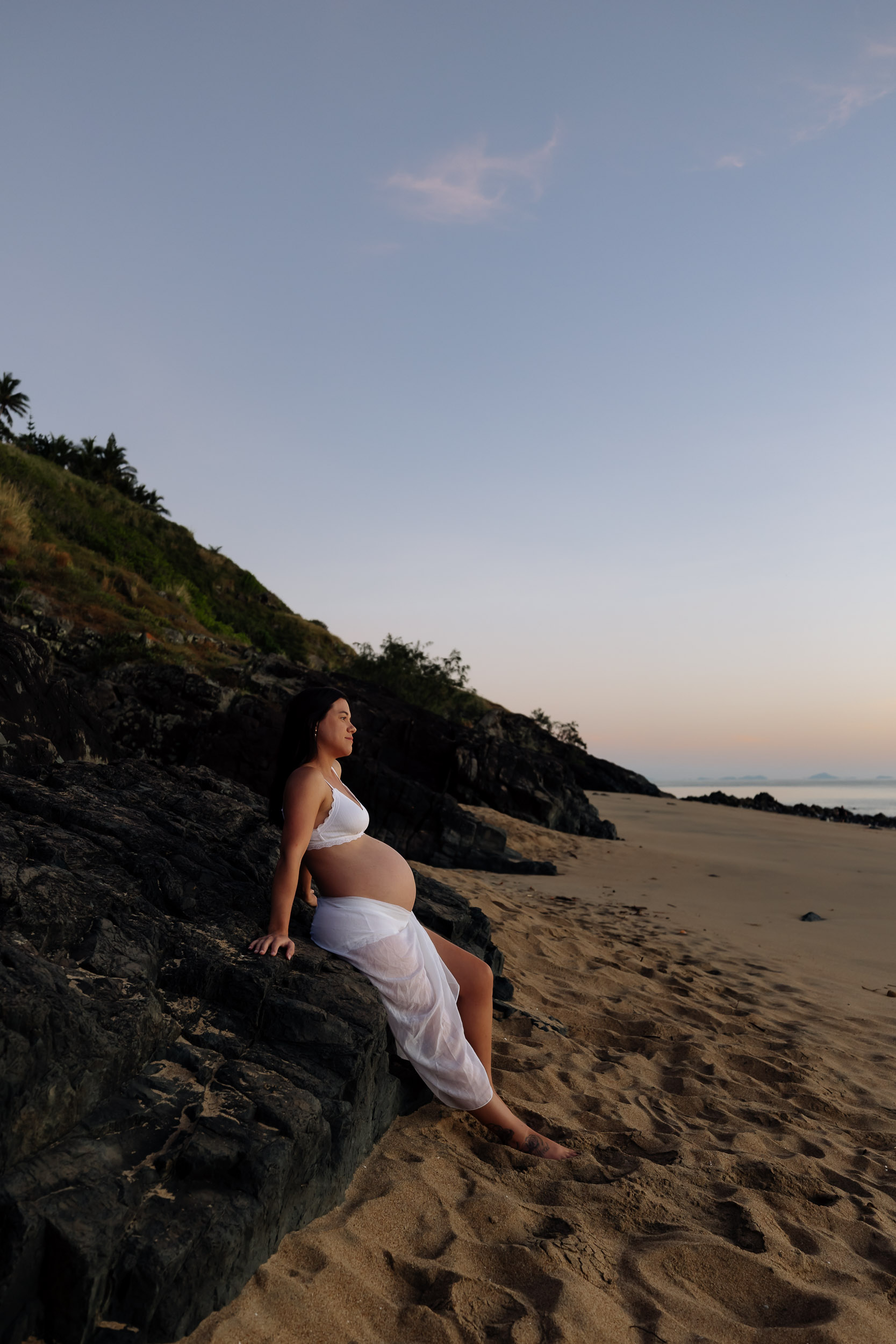 pregnancy photoshoot Blacks Beach Mackay coastal rocks soft sunrise natural maternity portrait