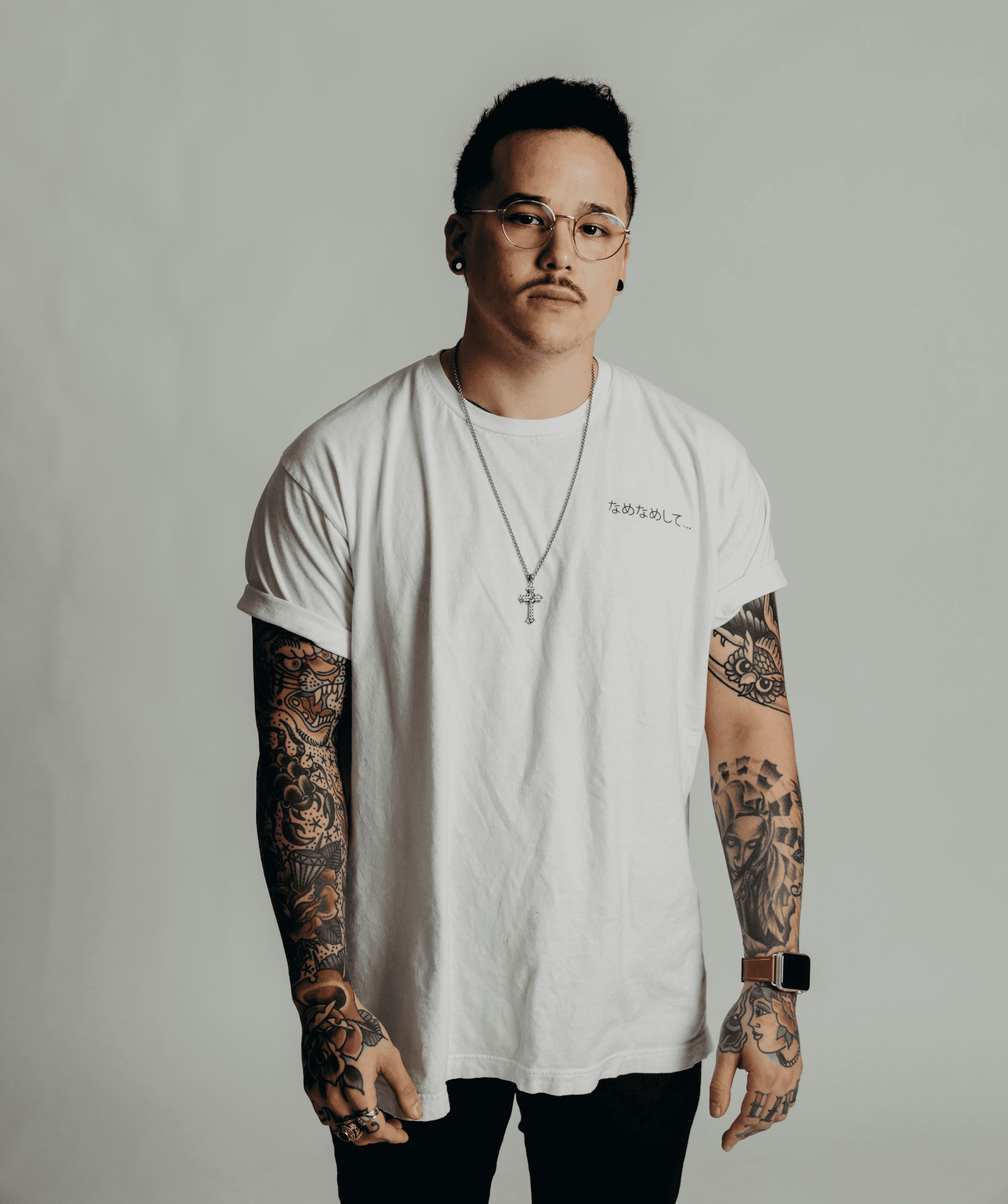 man in white and brown striped tank top wearing sunglasses