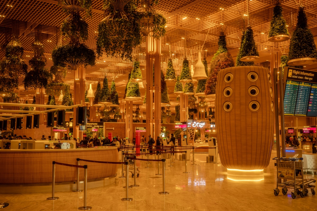 A bright modern international airport terminal interior with travelers