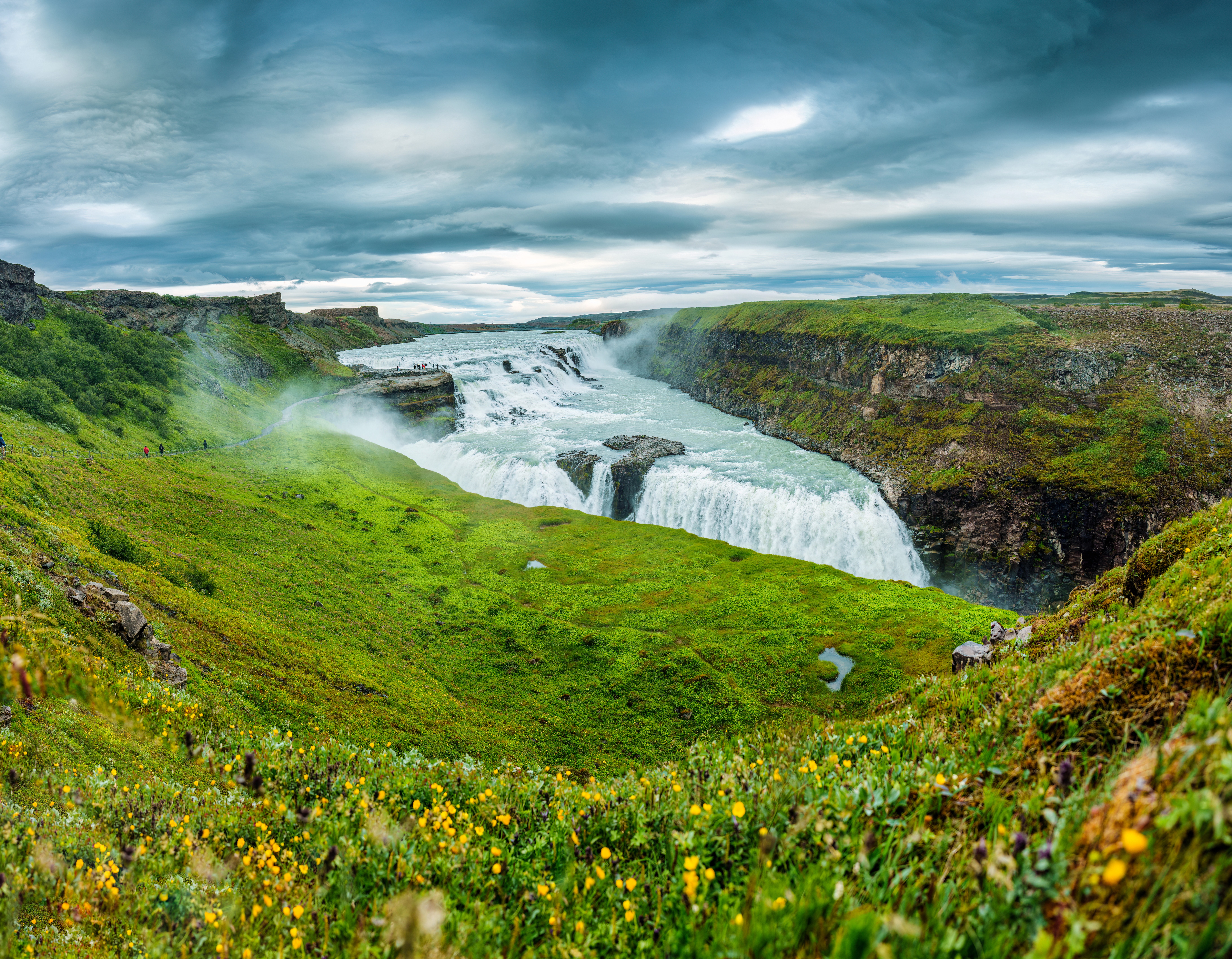 gullfoss in the summer with greenery around