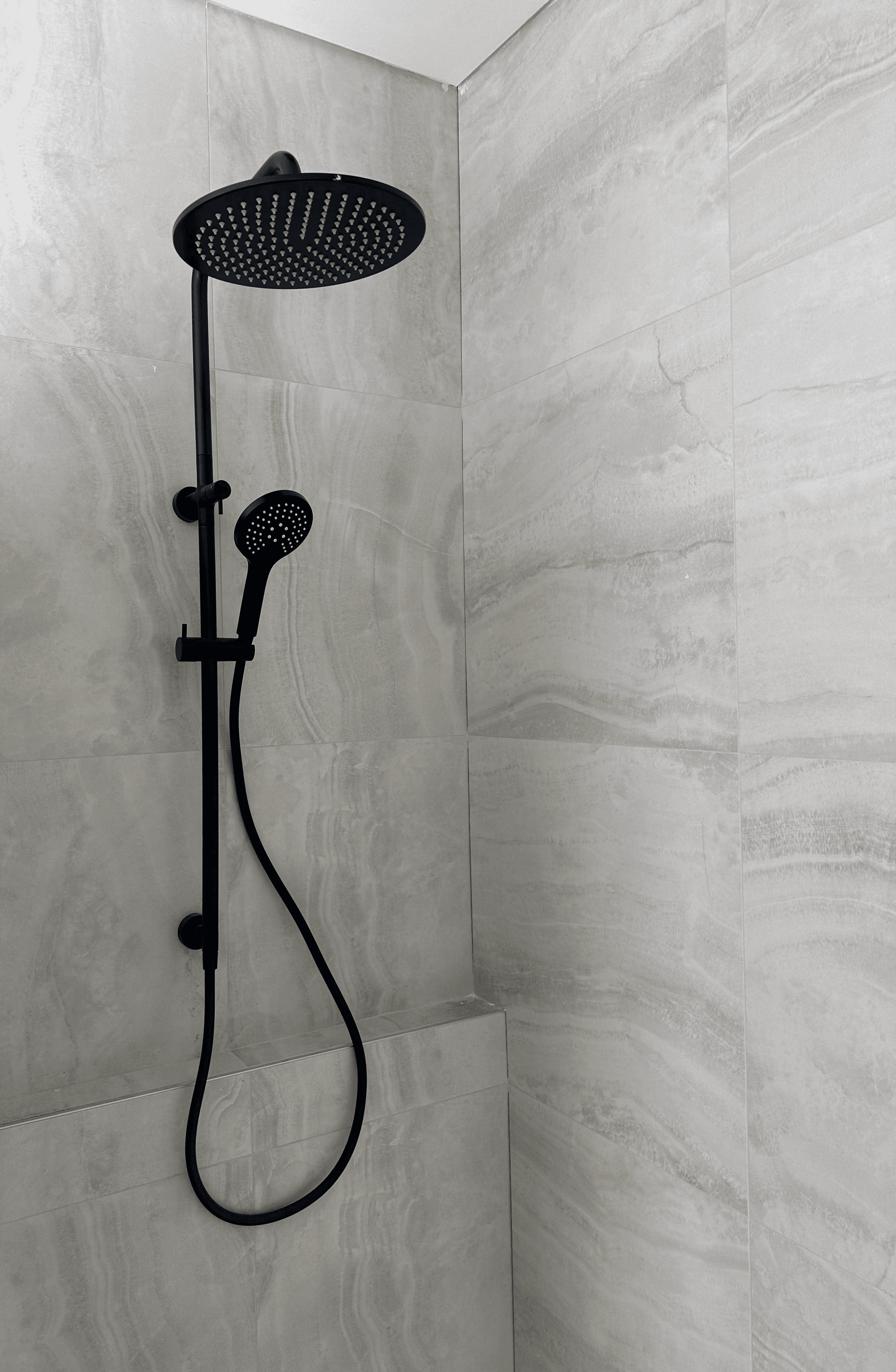 Electrician drilling in a wall