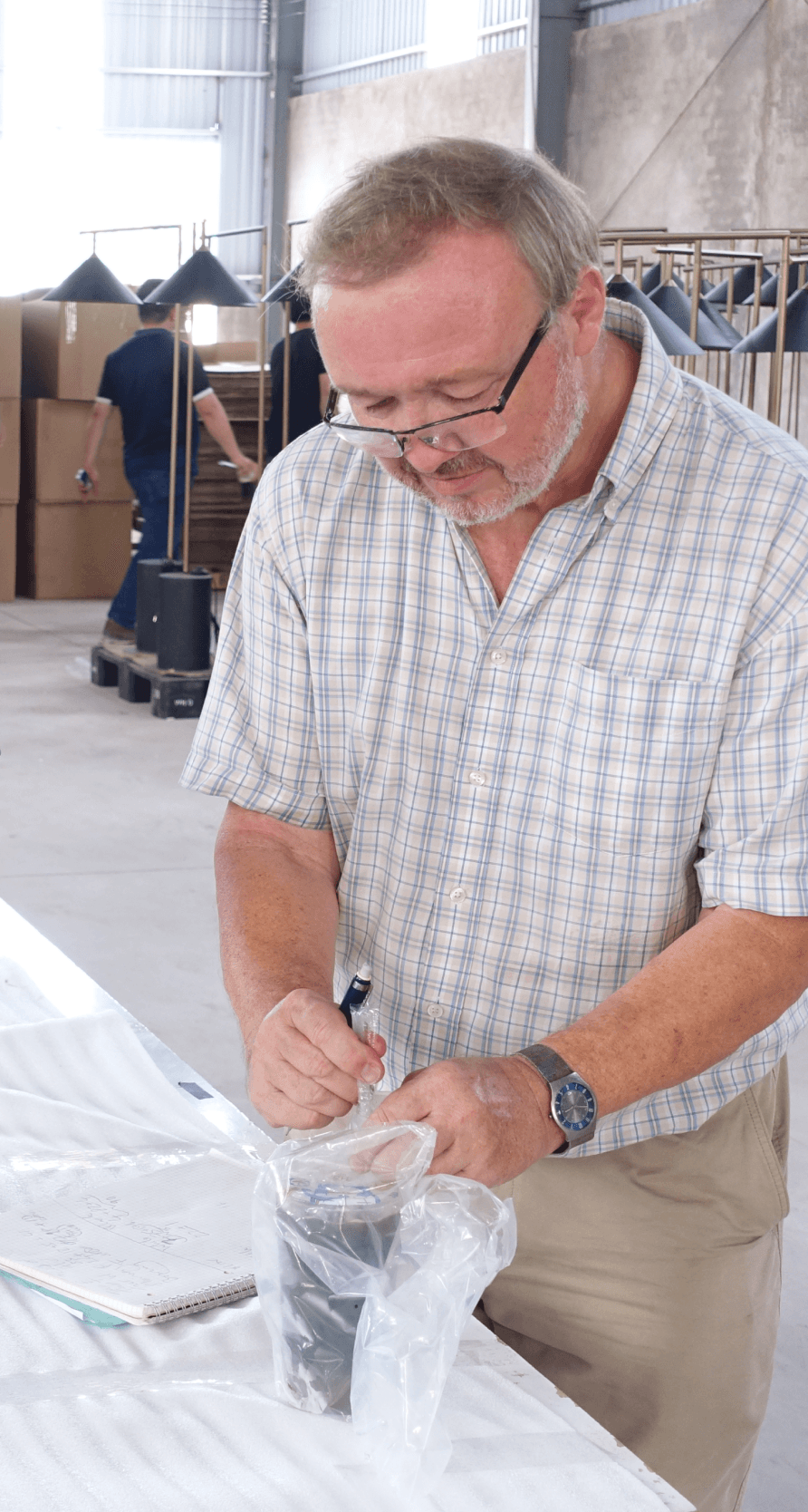 John Eastwood working in a factory