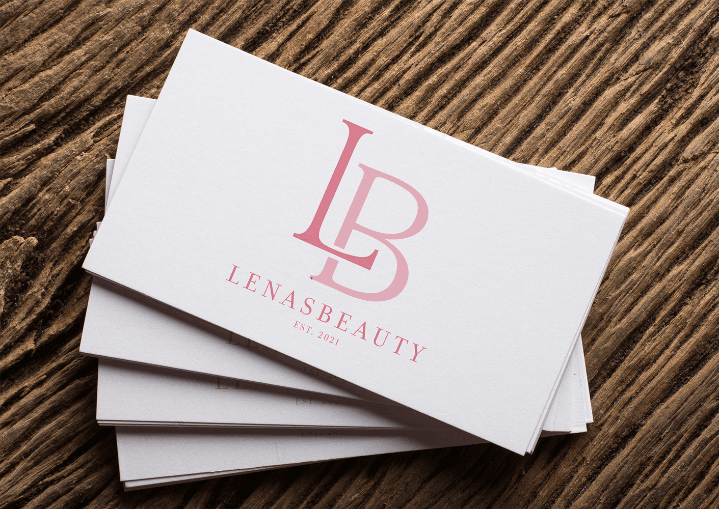 White branded cap with turquoise logo placed on fresh lemons in a red bowl