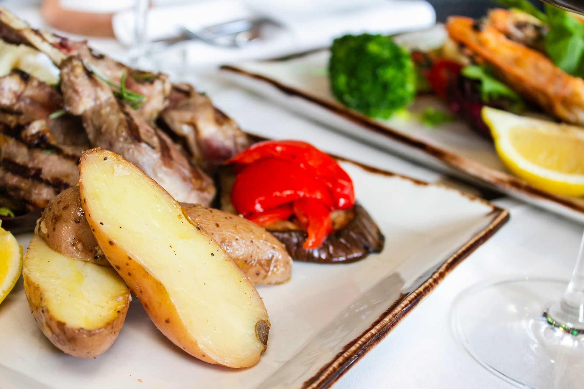 Grilled Icelandic meal with roasted potatoes and seasonal vegetables served at a restaurant in Reykjavík.