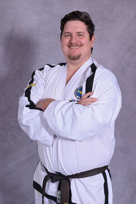 Instructor Marvin posing arms crossed