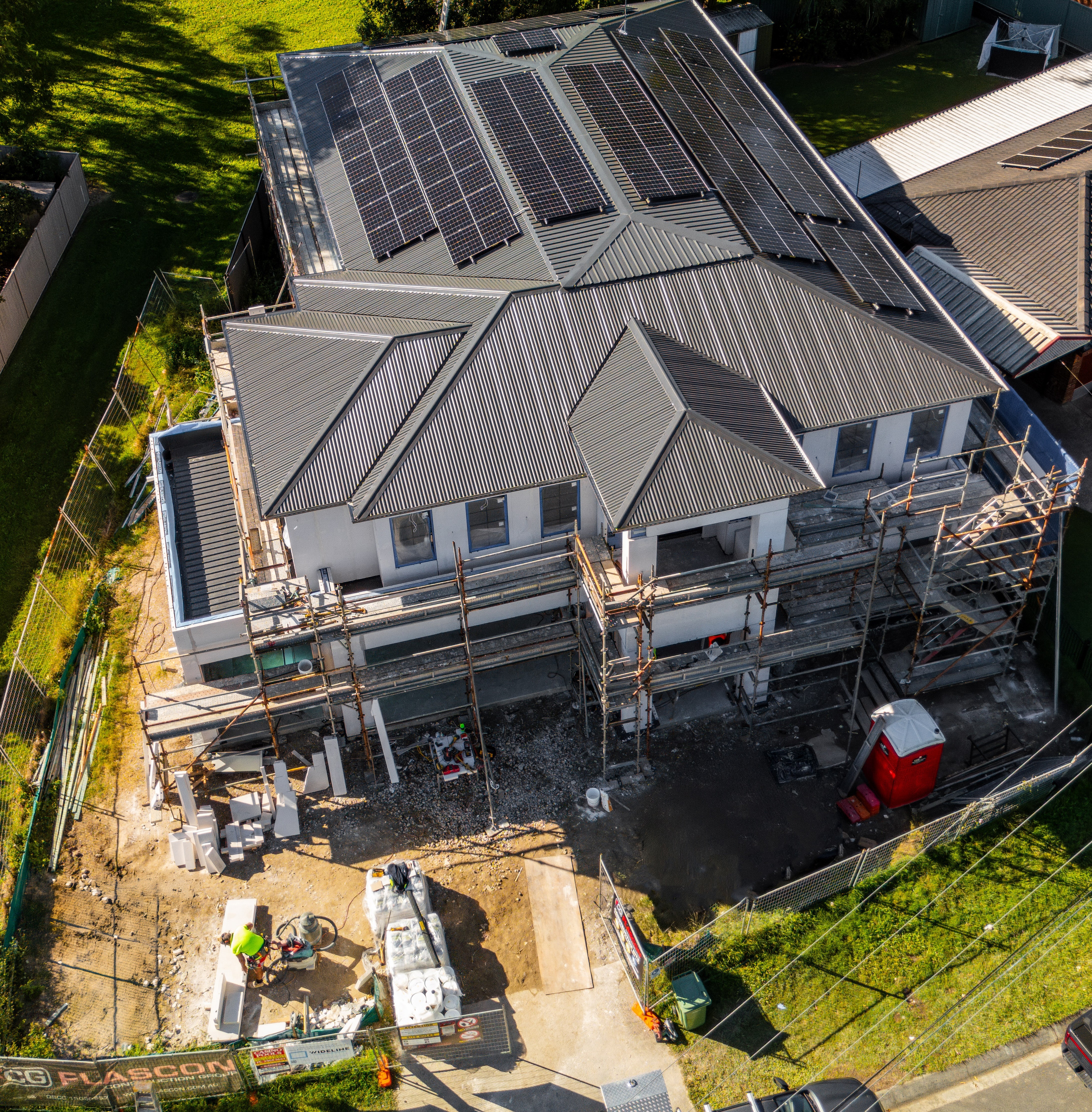 Aerial view of a Flascon Construction Group custom home under construction in Brisbane, ready for a building certifier inspection.