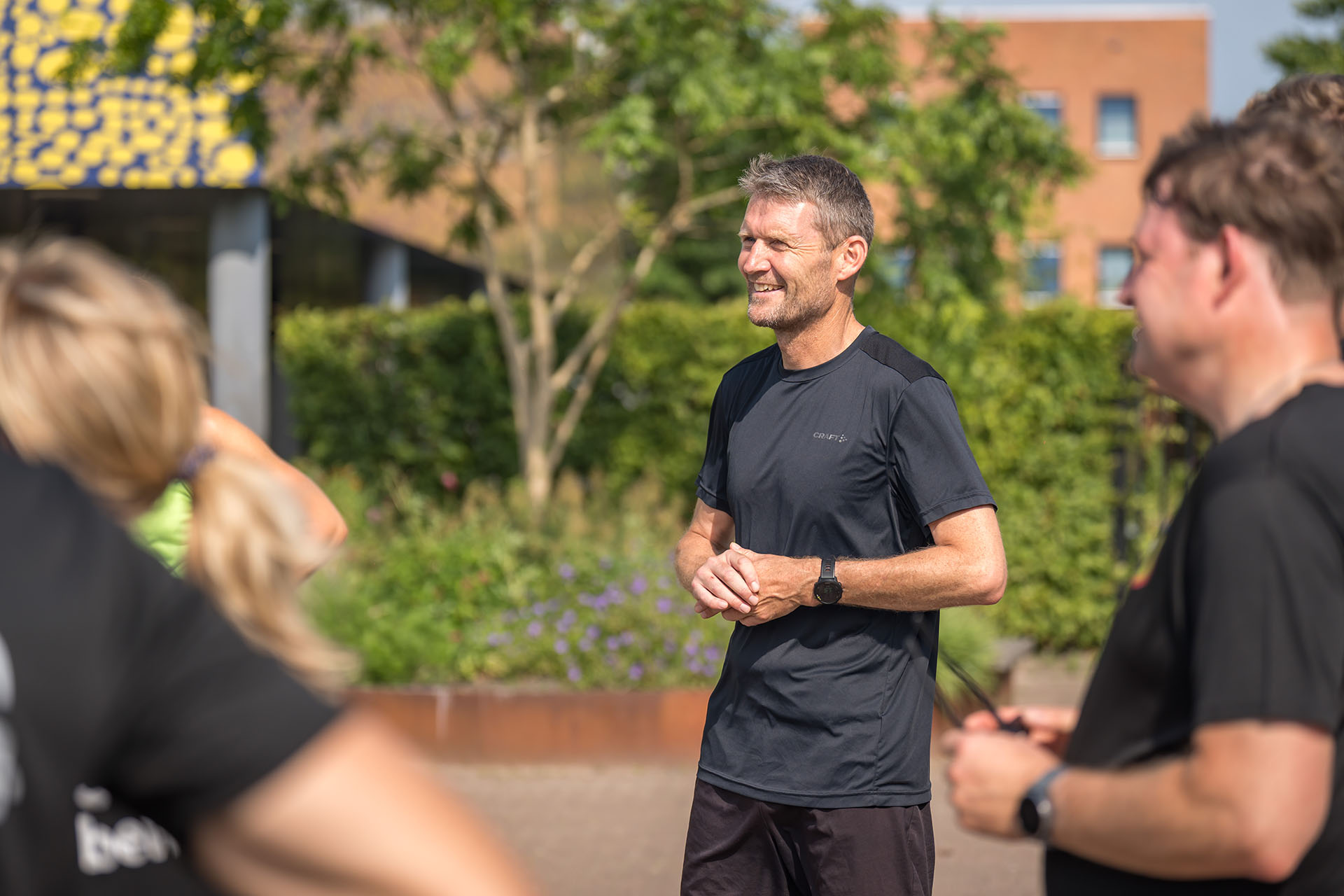 Snowboarder enjoys a downhill run on a sunny day.