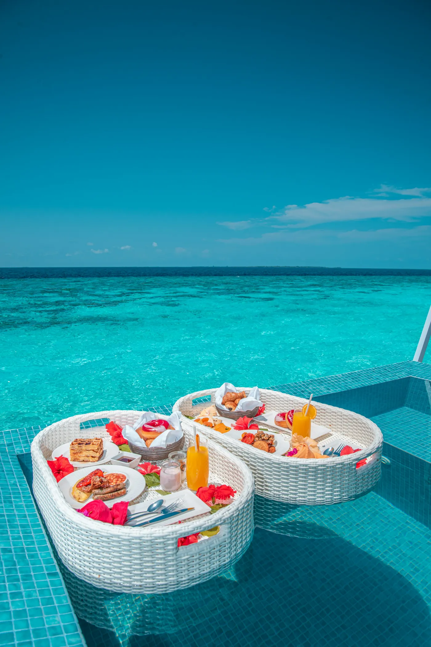 Floating breakfast trays in a villa pool