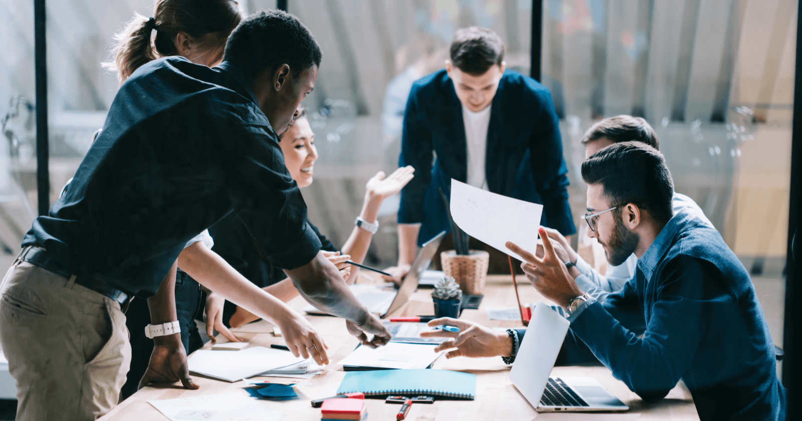 Team collaborating in office - How To Follow Up With A Sales Lead