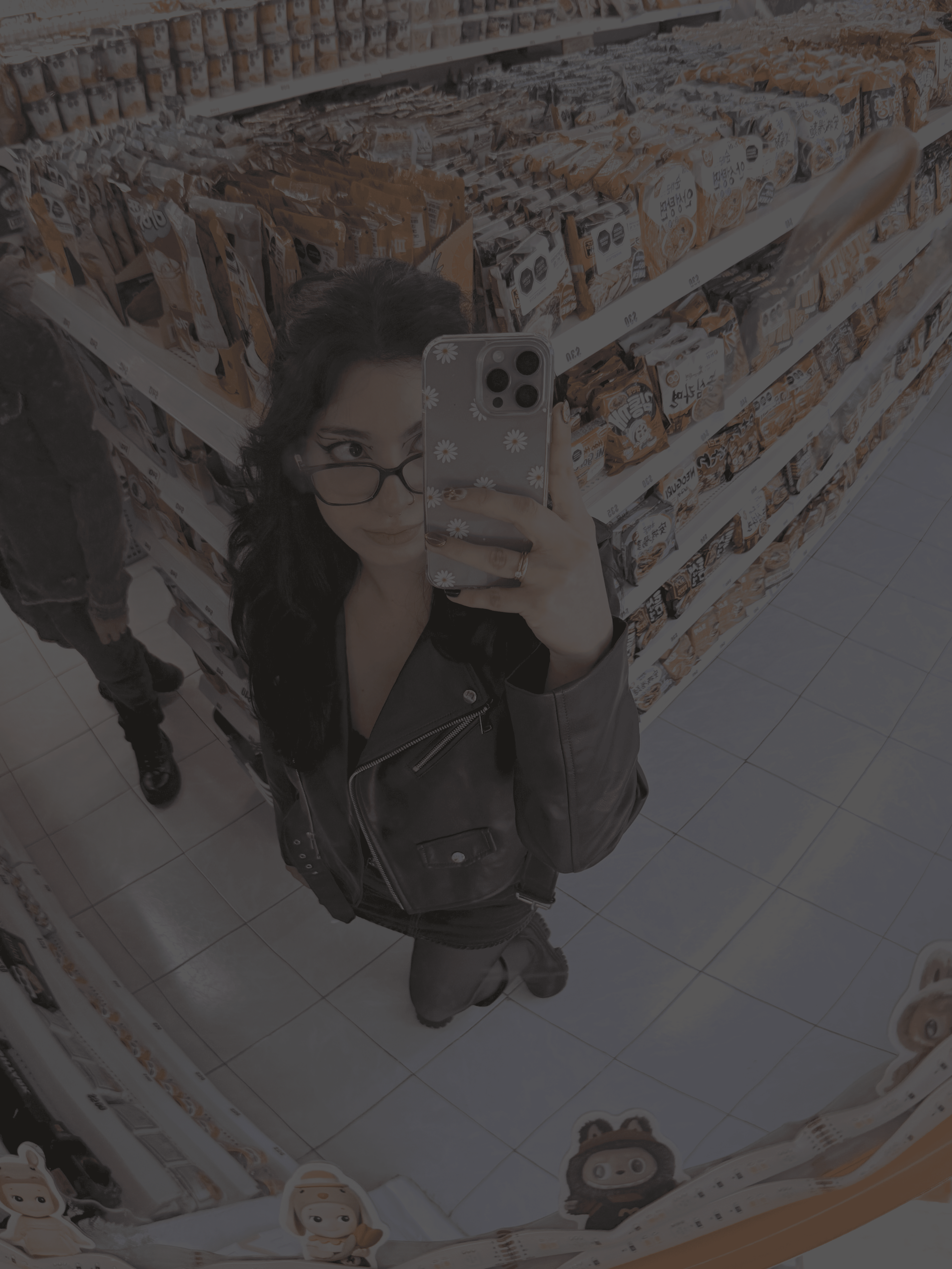 gold and black bottle on white wooden table