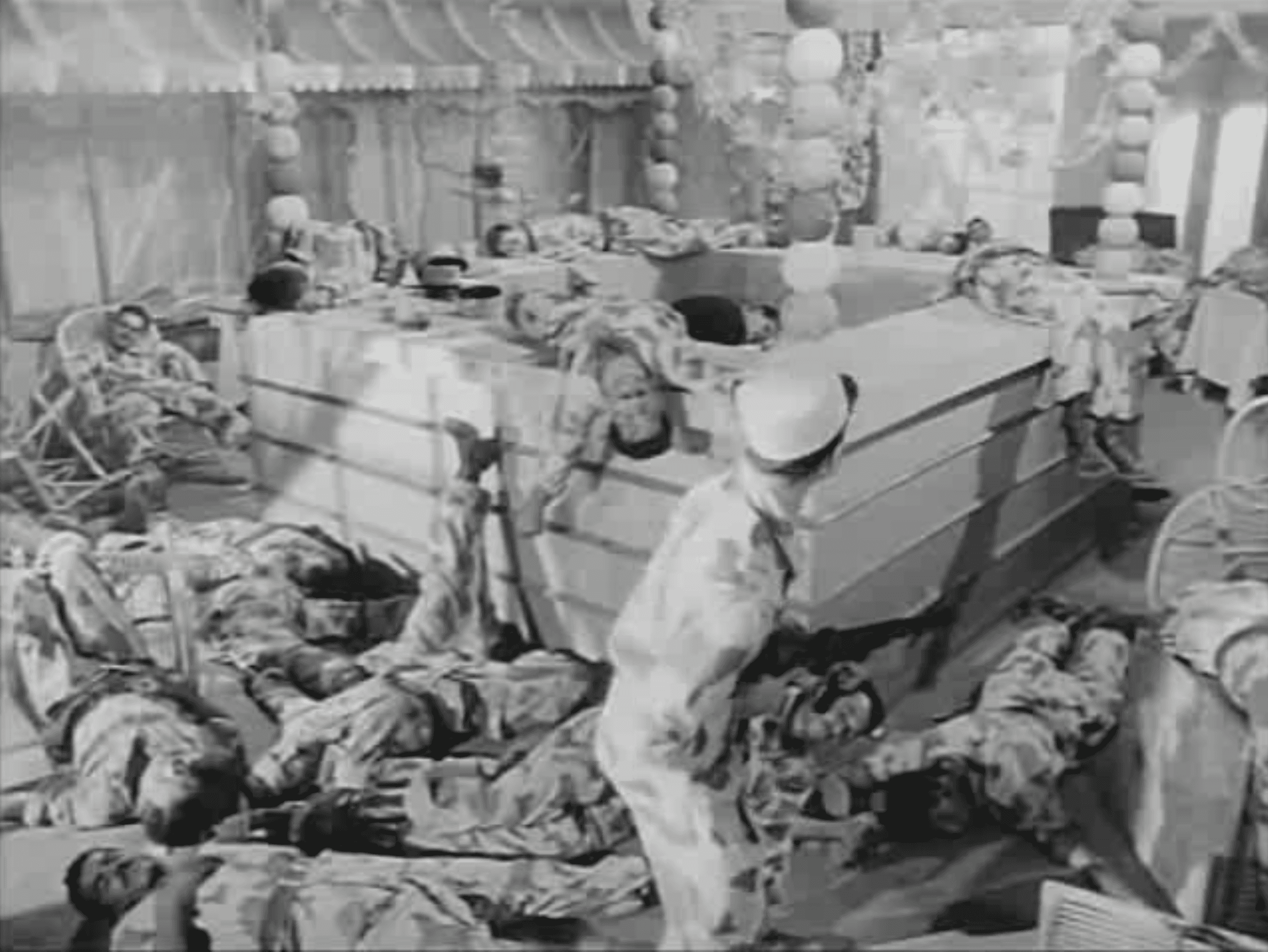 A wooden cube teeters on the edge of a rectangular block against a plain background.