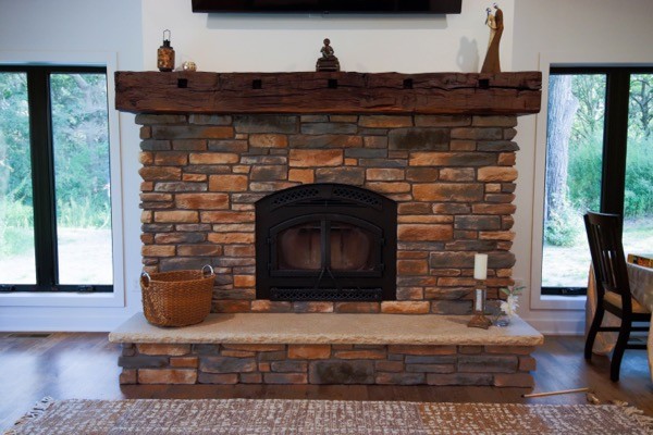 Living room with stone fireplace