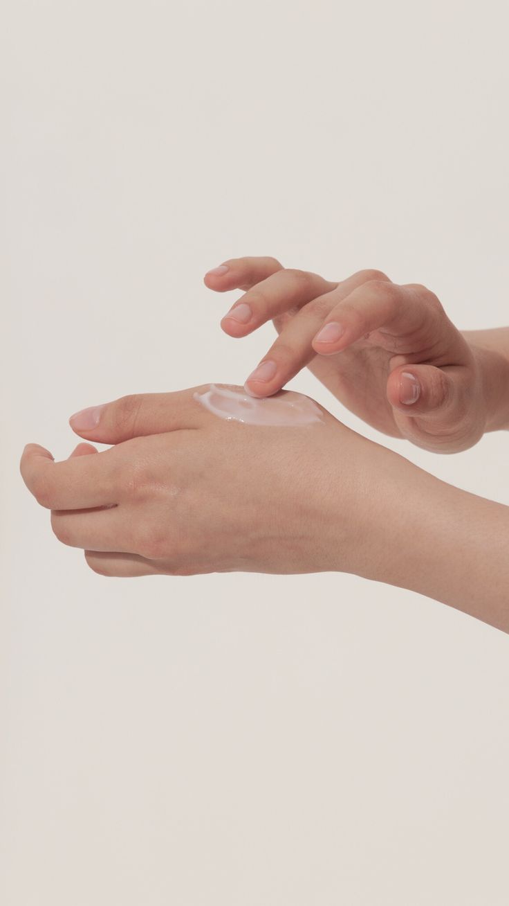 rubbing OxiBalm on hand