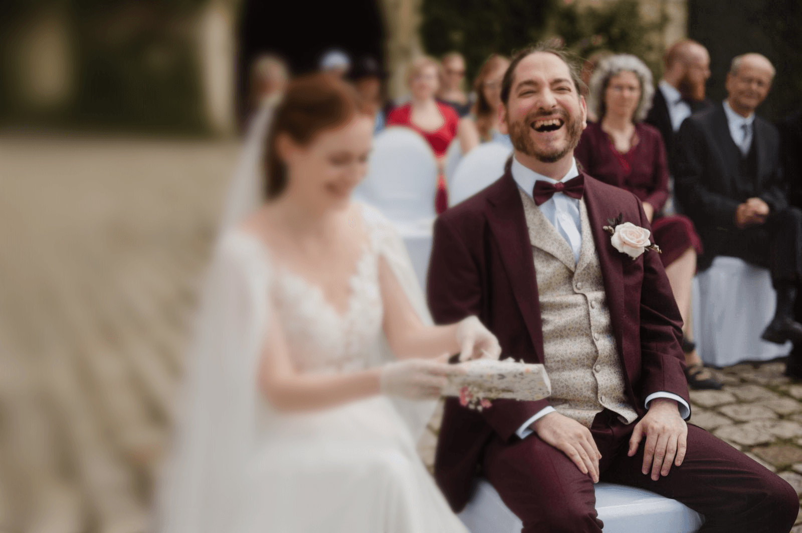 A fast black sports car races down the highway.