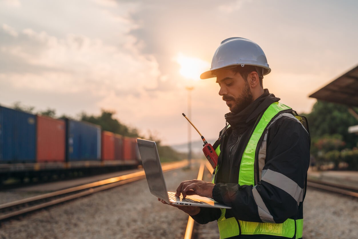 Stock image of transportation worker on railroad tracks