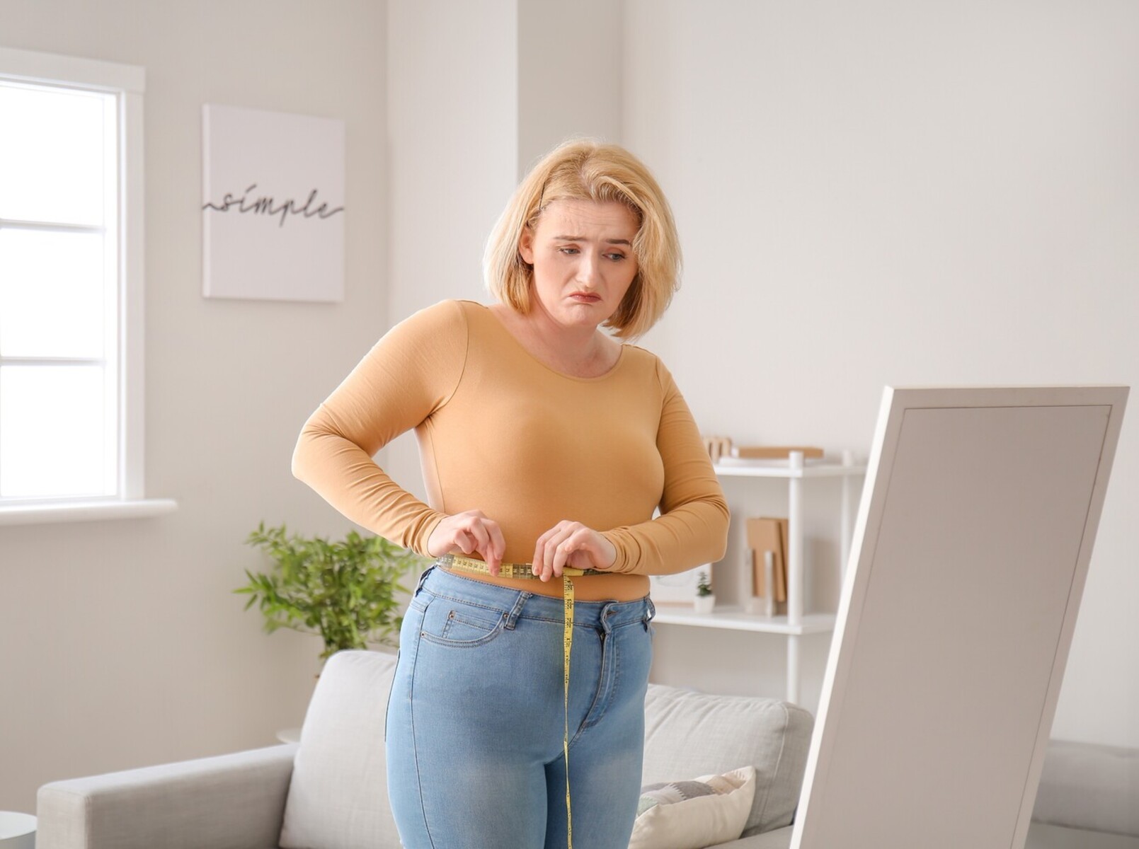 woman disappointed at her weight loss no exercise results