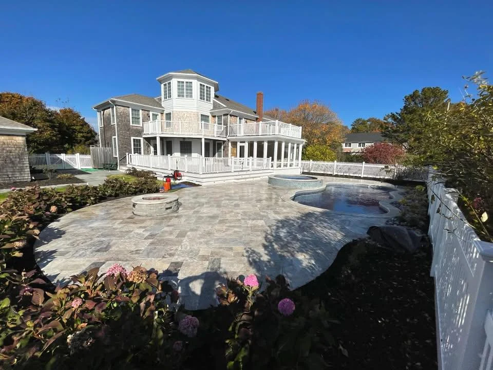 Price Landscape and Construction finished project at a residential home of stone patio, outdoor firepit and pool