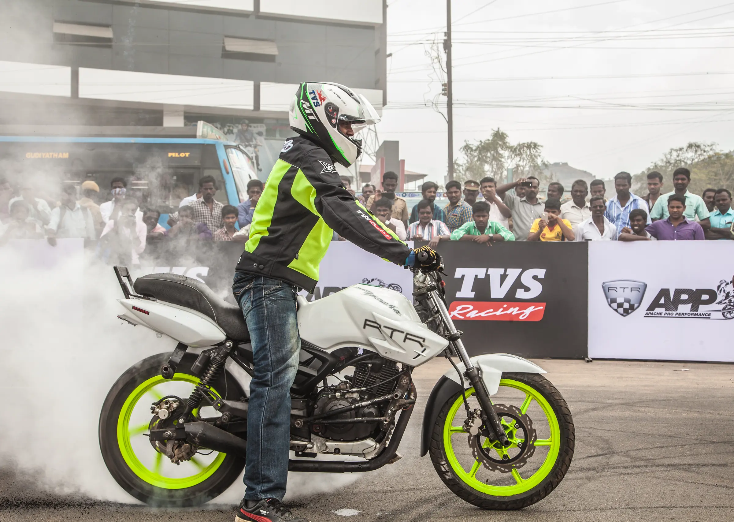 motorcycle displaying branding from "TVS APP" ATF Racing, photography by tapecassette