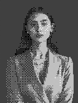 A pixelated black-and-white image of a woman in a suit, conveying a professional and serious tone. She has long hair and gazes softly at the camera.