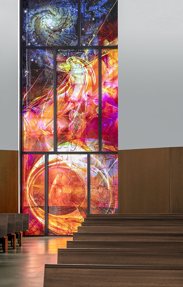 Stained Glass altar image of the Nativity of Jesus, referencing the popular outcome of the Greccio experience with the torch light window