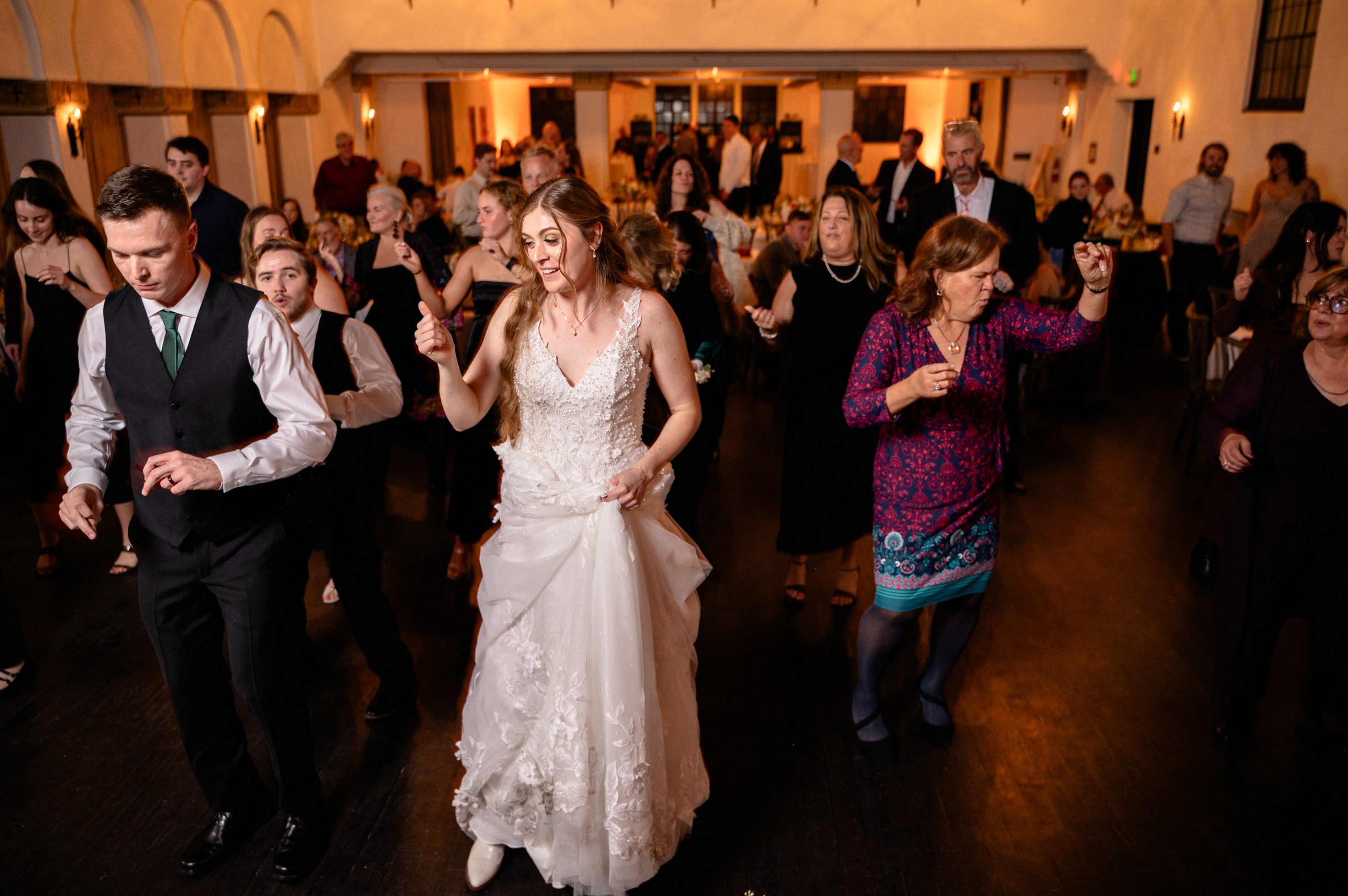 Flat lay wedding details with bouquet, rings, and sparkling bridal heels