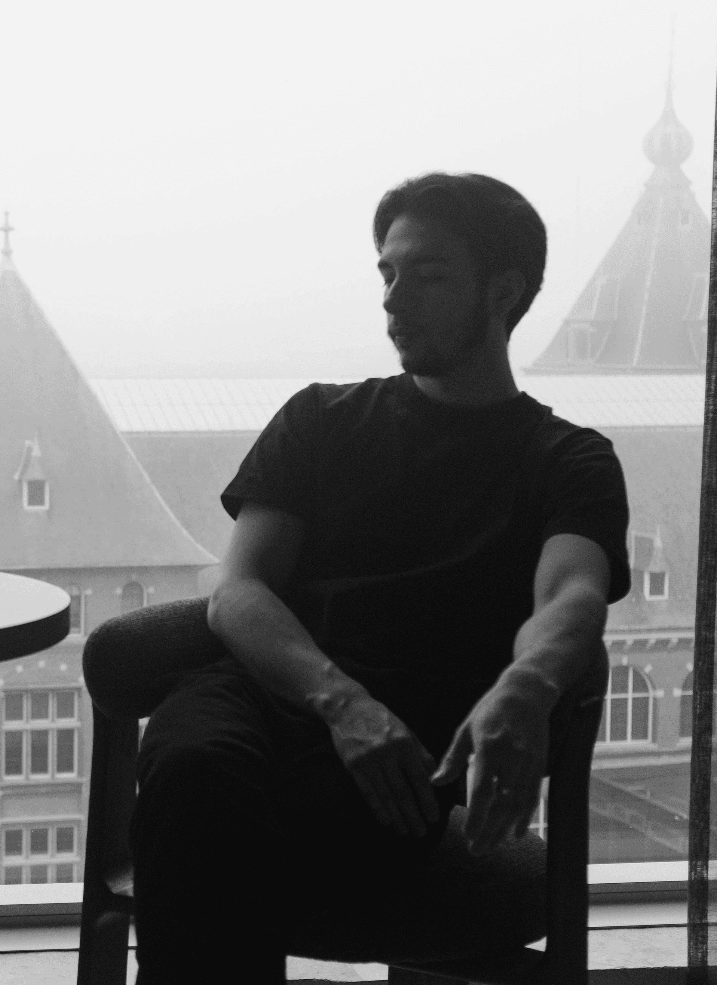 a blurry photo of a person standing in front of a wall