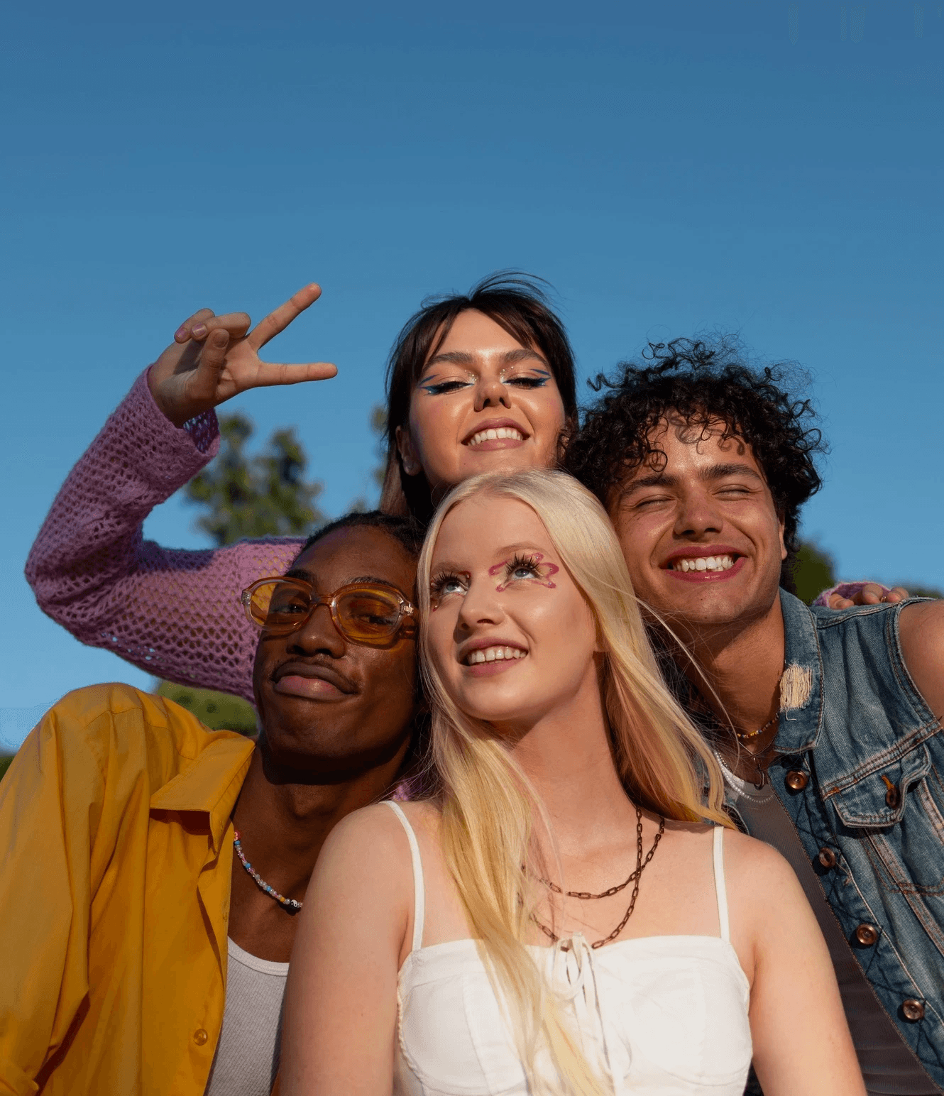 Extreme close-up of a young woman's face framed by strands of blond hair.