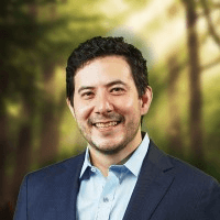 woman in black long sleeve shirt sitting on white couch