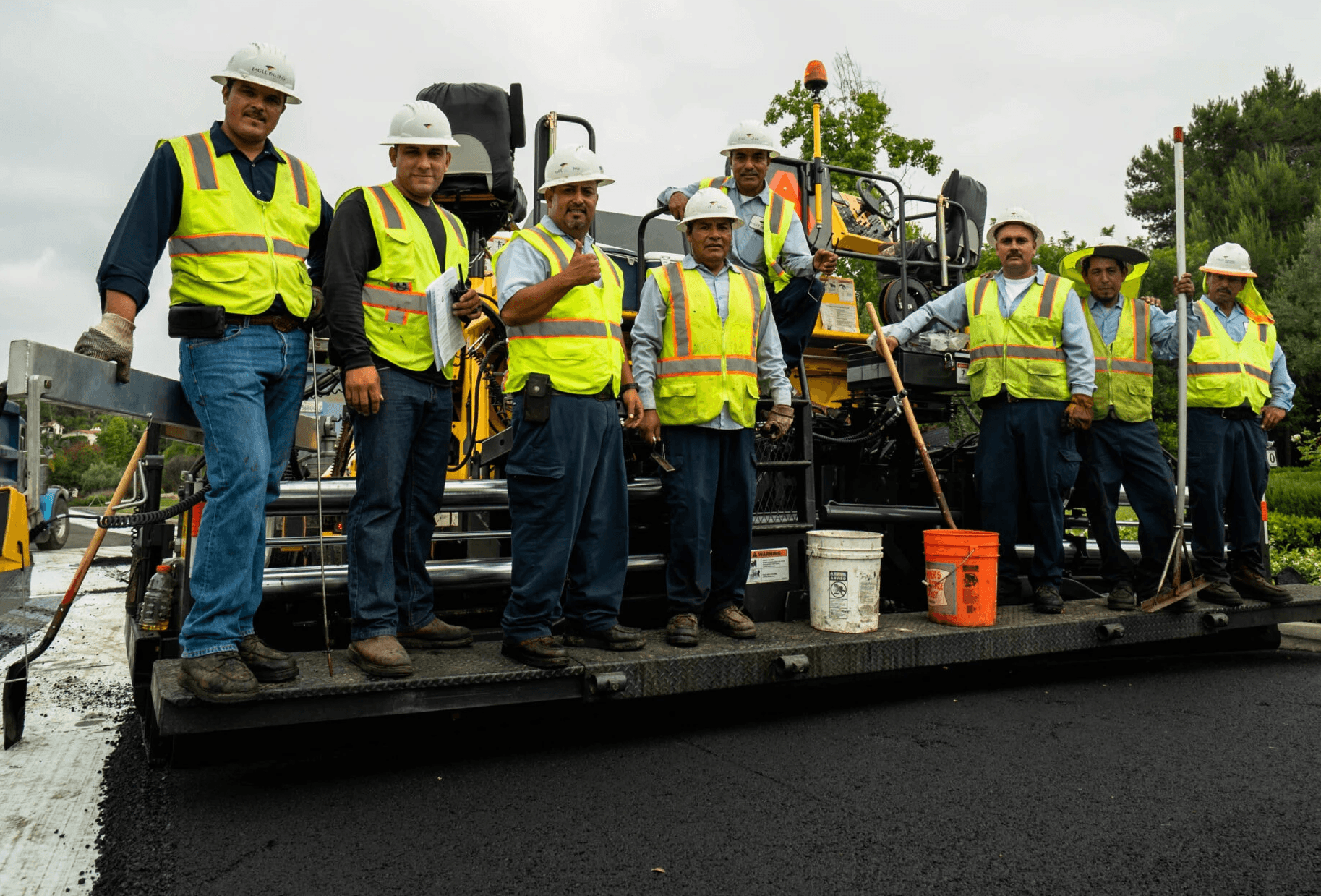 Asphalt paving crew on paver