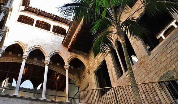 Gothic arches and a palm tree in the courtyard of the Picasso Museum, Barcelona