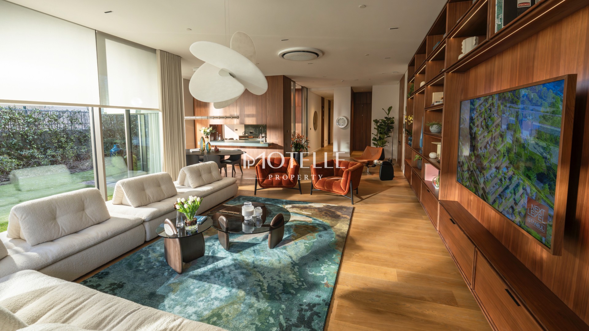 Luxury villa-style residence in Etiler Istanbul featuring an elegant living room, floor-to-ceiling windows, private garden and swimming pool.