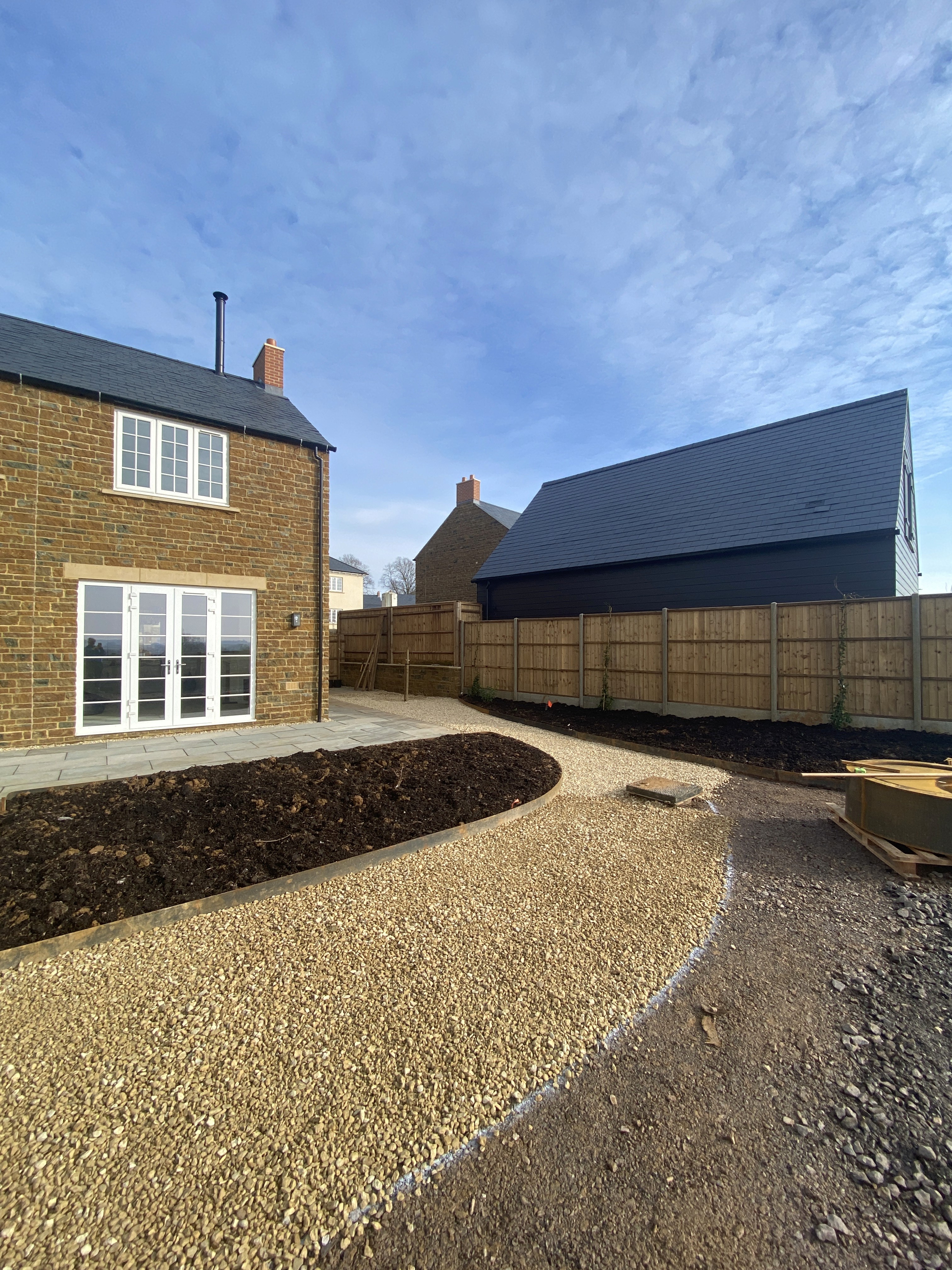 Cotswold stone paving and timber details.