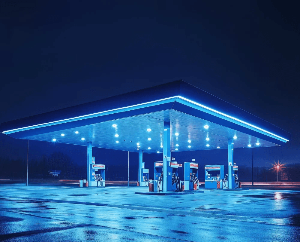 Petrol station at dusk, representing 24/7 operational monitoring and maintenance for retail fuel sites.