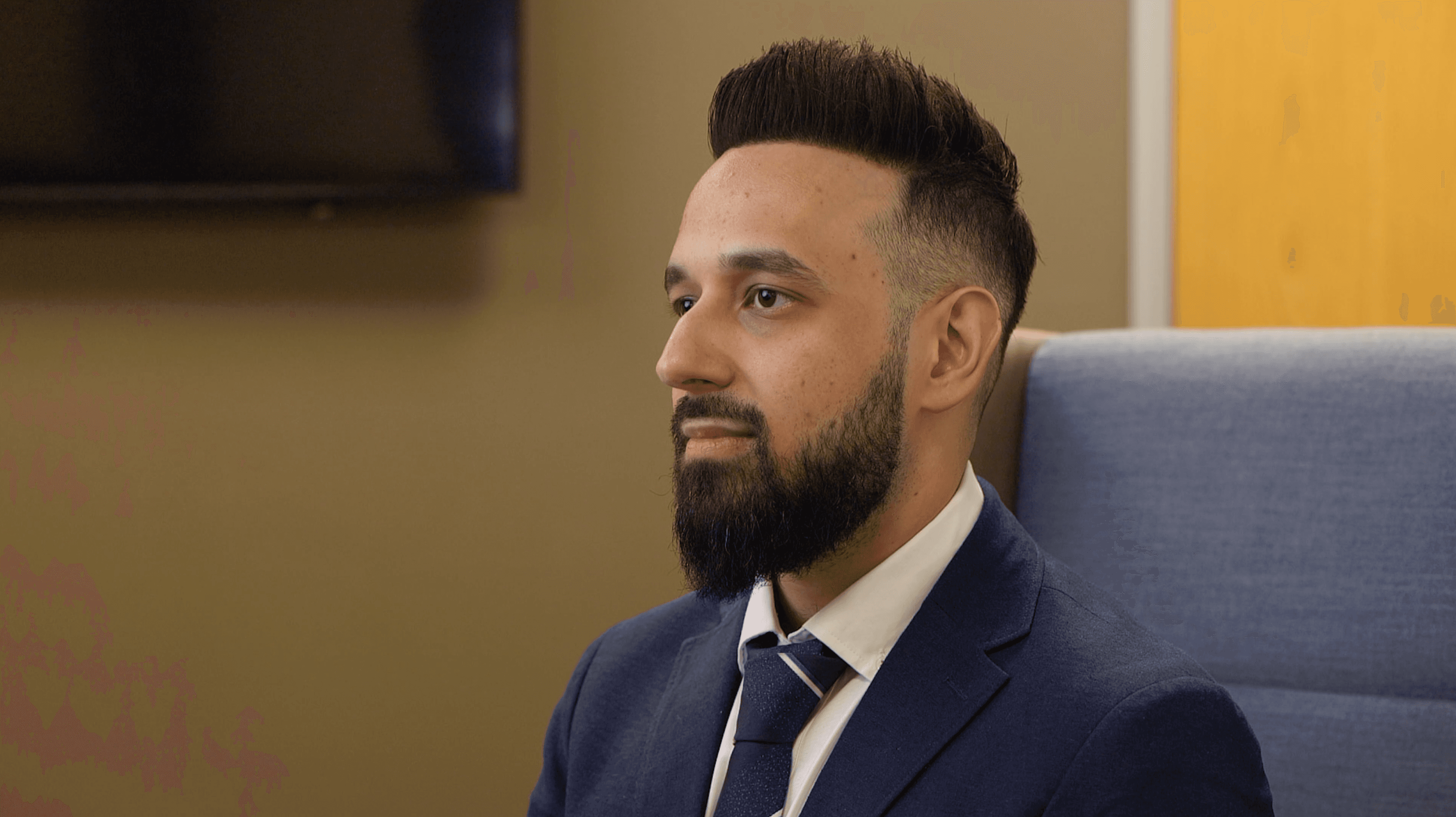 A closeup shot of an Optometrist being interviewed. 